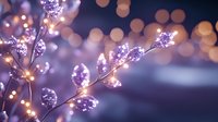 Delicate crystal branches with warm LED lights creating magical bokeh effect against soft purple background for holiday decorating and festive celebrations.