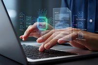 Businessman hands typing on laptop with holographic AI chip and digital interface icons floating above keyboard representing artificial intelligence technology.