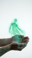 Cupped hands releasing ethereal green smoke figure on white background symbolizing spiritual energy, soul protection and metaphysical healing concepts.