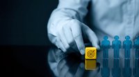 Business professional selecting yellow cube from blue human figures representing recruitment, leadership choice, and talent management in corporate environment.