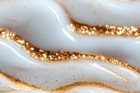 Luxurious white marble texture with flowing gold glitter veins creates elegant abstract waves and curves on smooth surface, macro photography for luxury design background.