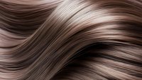 Flowing brown hair strands with natural highlights creating smooth waves and texture for beauty and haircare concepts.
