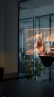 Businessman touching holographic display with financial charts and growth graphs in modern office environment for business analytics and data visualization.