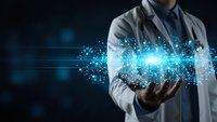 Doctor holding glowing digital particles and light effects representing medical technology innovation and healthcare data analysis.
