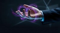 Hand holding glowing purple and blue energy orb with swirling light effects, representing innovation, technology, power, magic, and digital transformation concepts.