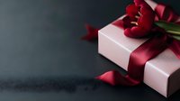 Pink gift box with burgundy satin ribbon and red tulip flowers on dark background, romantic holiday present composition with copy space for text.