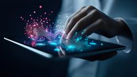 Hand touching digital tablet screen with glowing blue and pink particles emerging, creating magical technology visualization effect in dark background.