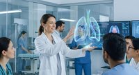 Female doctor presenting lung anatomy on digital screen to medical team in modern hospital conference room during educational training session.