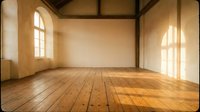 Empty rustic interior room with wooden plank flooring and exposed ceiling beams. Natural sunlight streams through arched windows creating warm atmosphere.