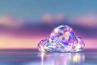 Iridescent crystal cloud shape on reflective surface against dreamy sunset sky with soft pink and purple hues creating magical atmosphere.