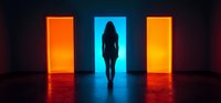 Female silhouette standing in glowing blue doorway between two orange illuminated doors creates dramatic neon lighting effect in dark corridor.