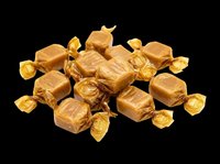 Wrapped caramel candies pile isolated on transparent background, ready for confectionery clipart, sticker, print on demand, sublimation, and t-shirt design use.
