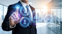 Professional businessman in suit touching digital interface with glowing technology icons in modern office environment representing business innovation and strategy.