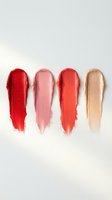 Colorful lipstick swatches in red pink coral and nude shades on white background for beauty cosmetics makeup and fashion design projects.