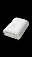 Folded white fluffy bath towel isolated on transparent background, ready for spa, hotel, bathroom design projects, clipart, stickers, and print on demand use.