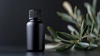 Black cosmetic bottle with olive branch on dark background, minimalist spa composition for natural skincare products and essential oils packaging mockup.