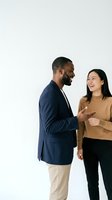 Two professionals engaged in friendly conversation against white background, isolated for design use on marketing materials, websites, presentations, and corporate communications.