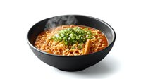Spicy Asian noodle soup with green onions in black ceramic bowl, hot steaming ramen topped with chopped scallions and tofu in red broth.