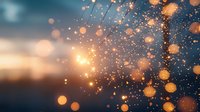 Magical glowing bokeh lights and sparkles against blurred sunset sky background create dreamy atmospheric effect for festive designs and holiday projects.