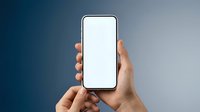 Hand holding smartphone with blank white screen mockup against gradient blue background for app presentation and mobile interface design.