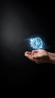 Human hands holding glowing brain and gear hologram representing artificial intelligence and machine learning technology on dark background.