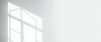 Sunlight streaming through window panes casting geometric shadows on white wall, minimalist interior design background for modern home decor projects.