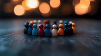 Diverse group of wooden figures standing in circle formation against blurred warm lights background, symbolizing unity, teamwork and inclusion.