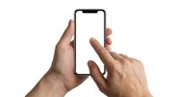Male hands holding modern smartphone with blank white screen, finger touching display for app interaction and mobile technology demonstration.