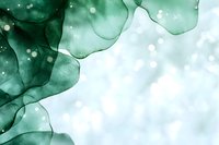 Ethereal emerald green watercolor abstract background with flowing organic shapes and light bokeh effects creates dreamy artistic atmosphere for design projects.