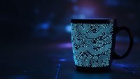Black coffee mug with glowing cyan circuit board pattern on dark background with blue purple bokeh lights for tech themed designs and electronics concepts.