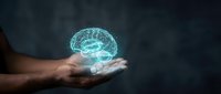 Human hand holding glowing digital brain hologram representing artificial intelligence, machine learning and neural network technology concepts.