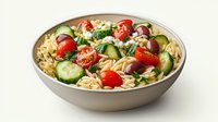Fresh Mediterranean orzo pasta salad with cherry tomatoes, sliced cucumbers, black olives, and herbs in gray ceramic bowl on white background.
