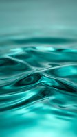 Abstract turquoise liquid waves flowing in smooth curves creating dynamic fluid motion background for modern design projects and digital art applications.