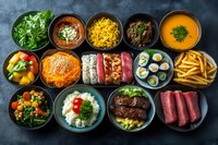 Various dishes in black bowls on dark background including sushi rolls, noodles, soups, salads, meat cuts, french fries and rice creating appetizing food composition.