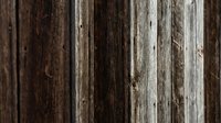 Weathered wooden planks with natural grain patterns and rustic texture for backgrounds and design projects.