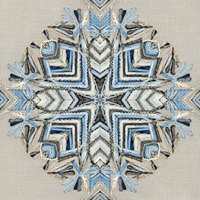 Intricate blue and beige mandala embroidery on linen fabric with geometric chevron patterns and decorative tassels for textile design projects.