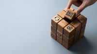 Hand placing wooden cube with smiley face on stack, representing customer satisfaction, feedback rating, and service quality evaluation for business and marketing.