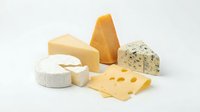 Assorted cheese varieties including cheddar, brie, blue cheese and swiss displayed on white background for food photography, culinary design and gastronomy projects.