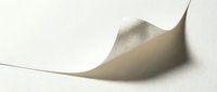 Elegant curved paper sheet with soft shadows creating minimalist abstract composition on neutral background for modern design projects.