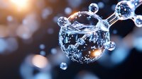 Macro photography of pure water drop with air bubbles inside reflecting light creating magical effect against dark background with bokeh and sunlight flare.