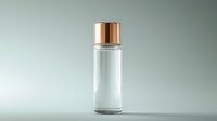 Clear glass cosmetic bottle with luxurious rose gold metallic cap on light background, minimalist packaging design for beauty and skincare products.