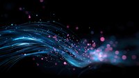 Glowing blue light trails with pink and purple particles flowing in dark space create magical energy effect for technology and science backgrounds.