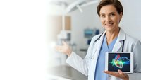 Female doctor presenting brain scan on tablet in modern medical facility with welcoming gesture for healthcare technology and neurological diagnosis.