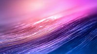 Vibrant macro photography of feather texture in pink and blue gradient lighting creates dreamy abstract background with selective focus and shallow depth of field.