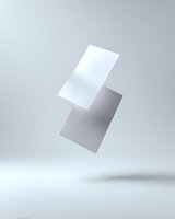 Floating white and gray business cards mockup on light background with soft shadows, minimalist design presentation for branding and corporate identity.
