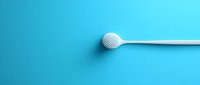 White plastic cotton swab with textured tip against vibrant blue background, minimalist composition for healthcare and hygiene concepts.