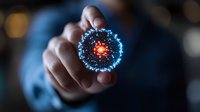 Glowing blue and red virus cell floating above hand in dark background, science visualization concept for medical research and healthcare technology advancement.