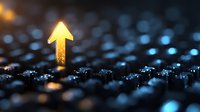 Glowing golden arrow pointing upward emerges from dark textured surface with blue bokeh lights, symbolizing growth, success and forward momentum in business.