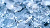 Macro shot of crystal clear ice cubes with soft blue tones and natural light reflections creating fresh, cool atmosphere. Suitable for beverage and cooling concepts.