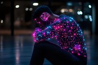 Young African American woman silhouetted against dark background with glowing purple and blue light constellation effect overlaid on body, creating ethereal artistic portrait.
